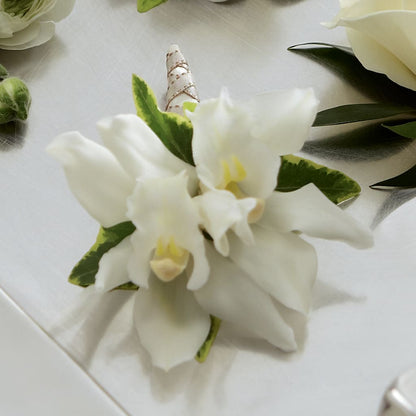 White Mini Cymbidium Boutonniere – KEITH'S FLOWER SHOP, Mount Gilead OH